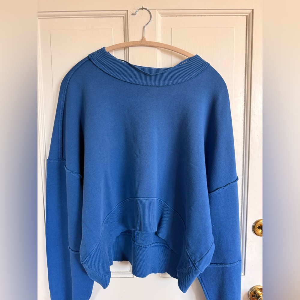 NWT We The Free Hi Lo Pullover 
Size Large 
Color True Blue